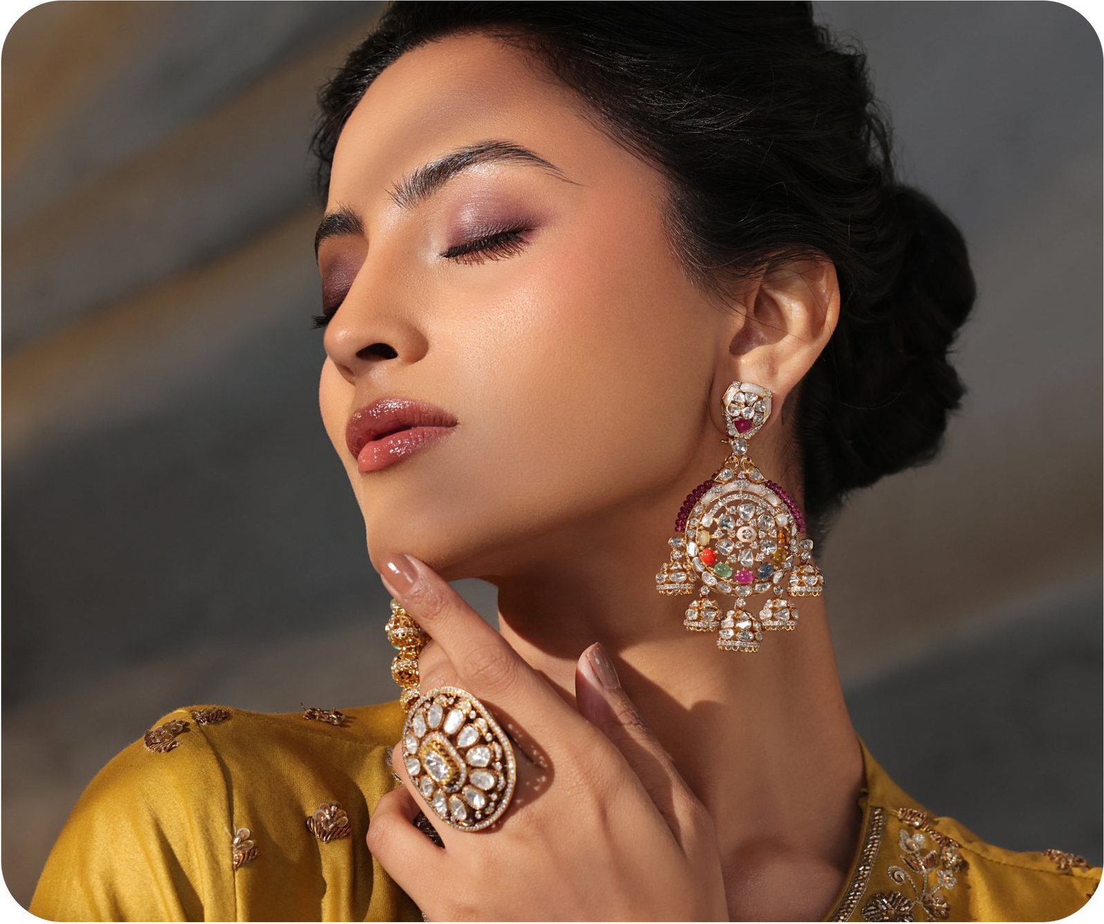 Model in yellow with chandelier earrings